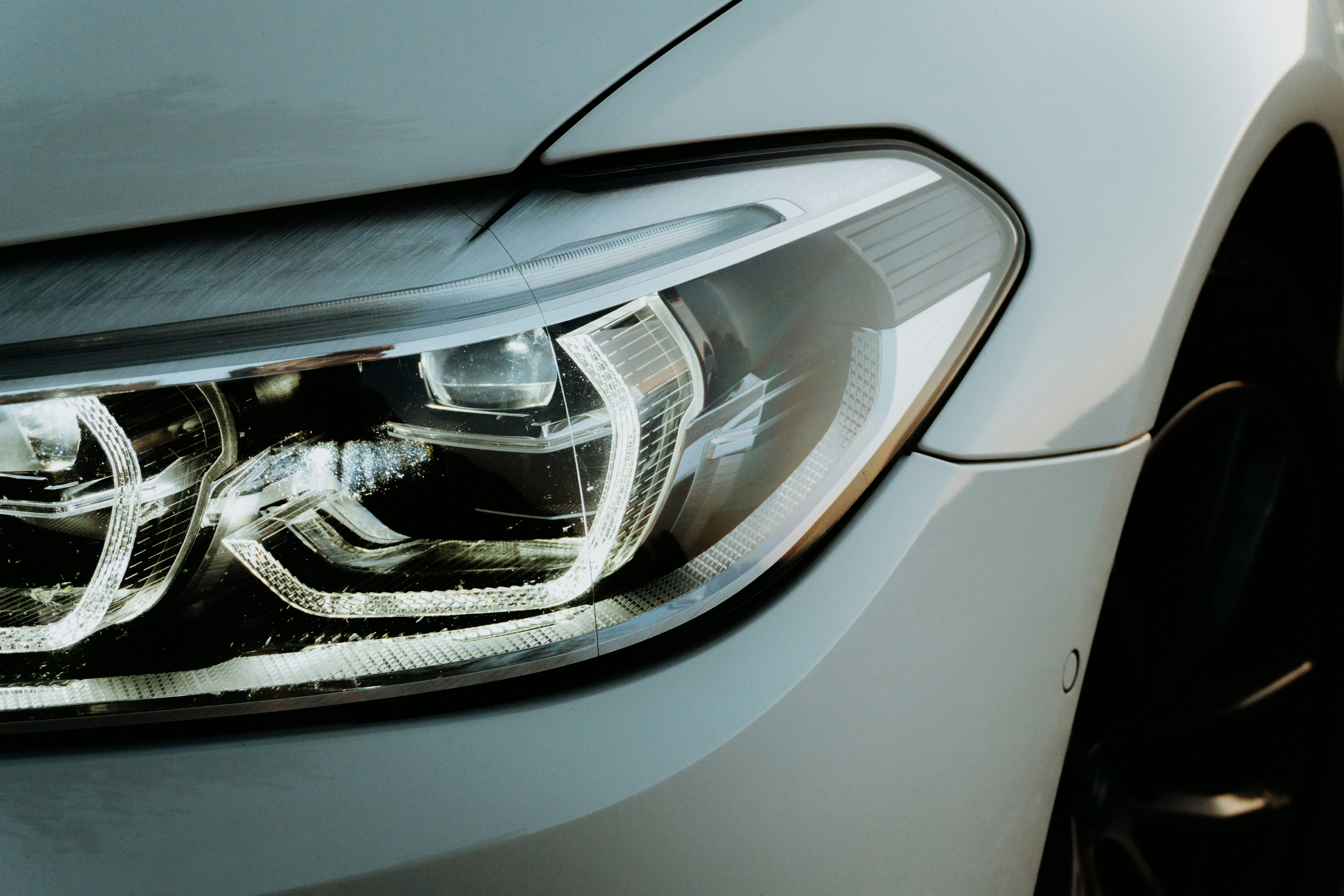 Luxury car headlight detail showing precision automotive work